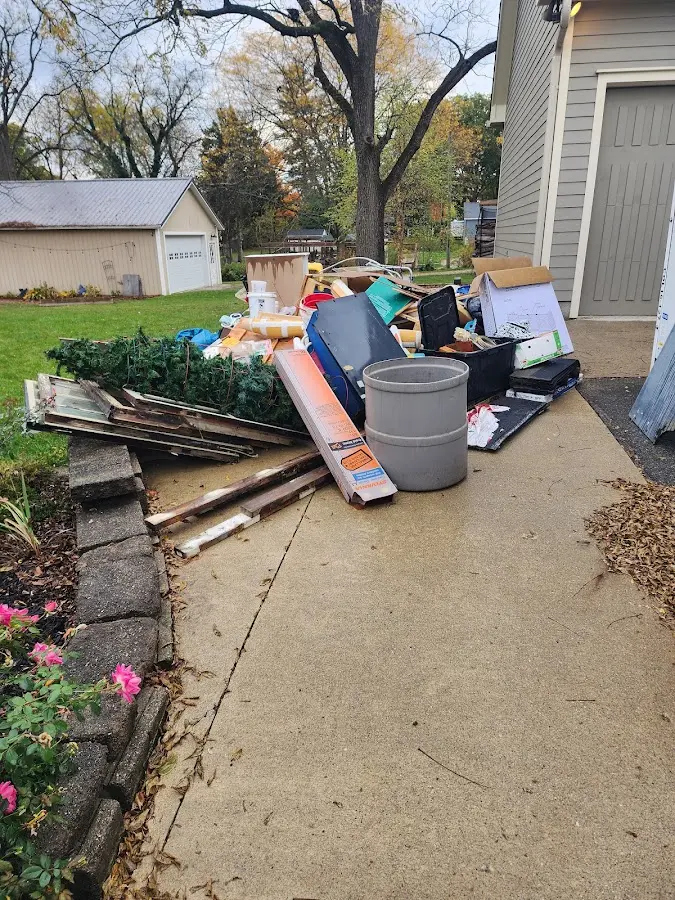 Dumpster being loaded with debris for Commercial Dumpster Rental in Flagstaff